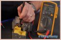 How do you test a Honeywell gas valve with a multimeter?